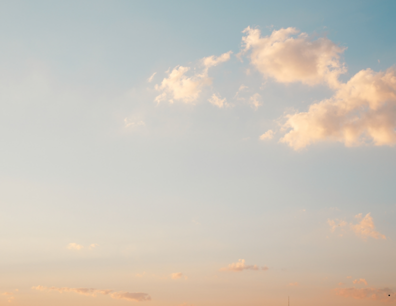 Soft sunset sky with pink and orange clouds